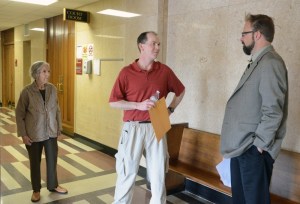 The Schulzes confer with attorney Ludwig after the hearing.
