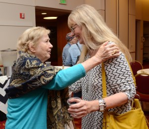 Minerva Montooth, left, and Dixie Legler Guerrero chat at the reception after the screening.
